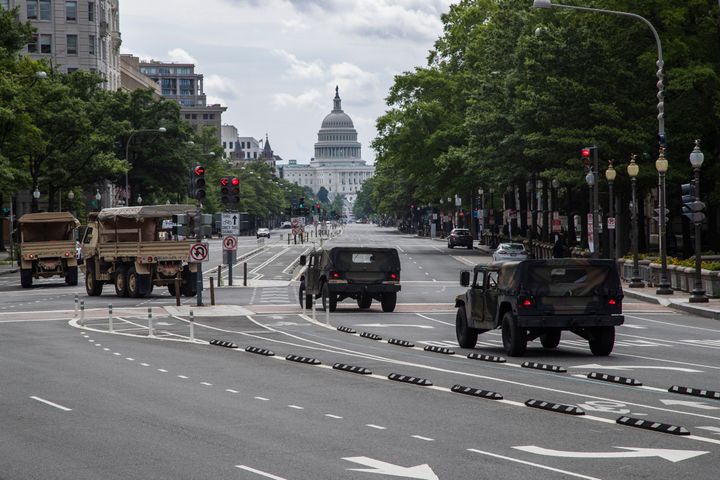 FILE - National Guard vehicles drive along Pennsylvania Avenue NW, as they prepare for protests and demonstrations, June 19, 2020, in Washington. U.S. officials say the Pentagon is developing plans to restructure the National Guard in Washington, D.C. The goal is to address problems highlighted by the chaotic response to the Jan. 6 riot and safety breaches during the 2020 protests over the murder of George Floyd. (AP Photo/Manuel Balce Ceneta, File)