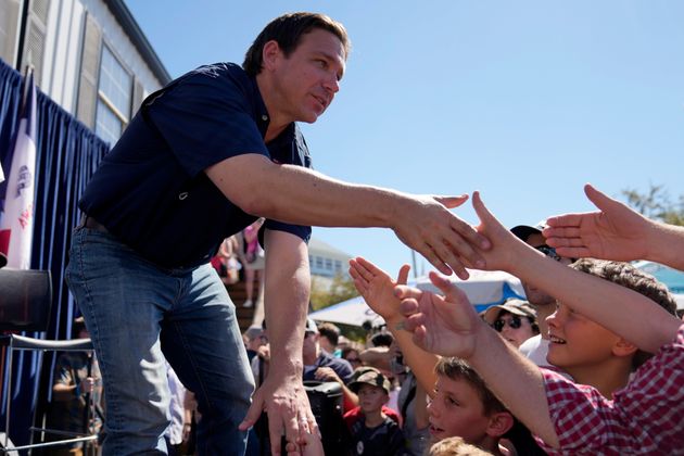 Republican presidential candidate Florida Gov. Ron DeSantis shakes hands with fairgoers after taking part in a Fair-Side Chat with Iowa Gov. Kim Reynolds at the Iowa State Fair, Saturday, Aug. 12, 2023, in Des Moines, Iowa. (AP Photo/Jeff Roberson)