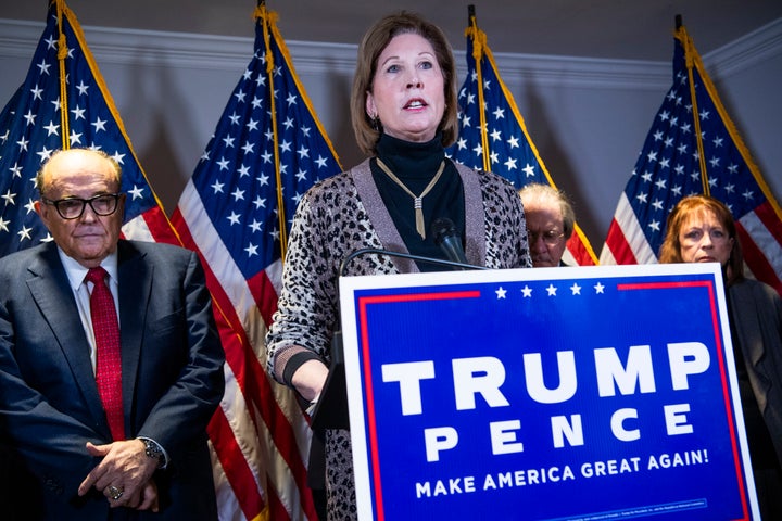 UNITED STATES - NOVEMBER 19: Sydney Powell, attorney for President Donald Trump, conducts a news conference at the Republican National Committee on lawsuits regarding the outcome of the 2020 presidential election on Thursday, November 19, 2020. Trump attorney Rudolph Giuliani, left, also attended. (Photo By Tom Williams/CQ-Roll Call, Inc via Getty Images)