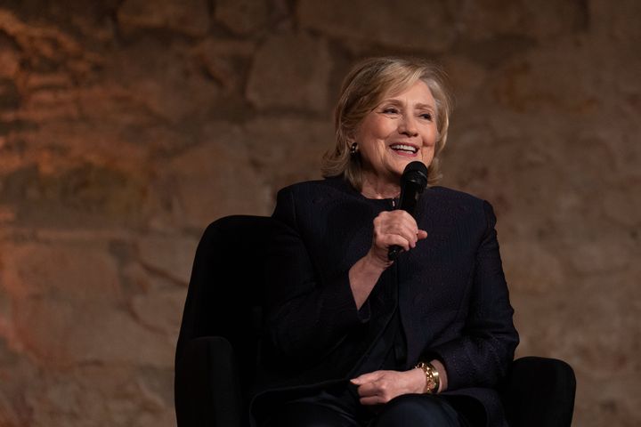 Hillary Clinton, shown here speaking in Barcelona, Spain, on June 23, said Monday that she felt a "profound sadness that we have a former president who has been indicted for so many charges." 
