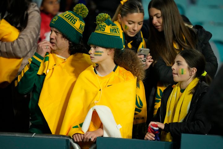 Australian supporters react after England won the Women's World Cup semifinal soccer match between Australia and England at Stadium Australia in Sydney, Australia, Wednesday, Aug. 16, 2023. (AP Photo/Rick Rycroft)