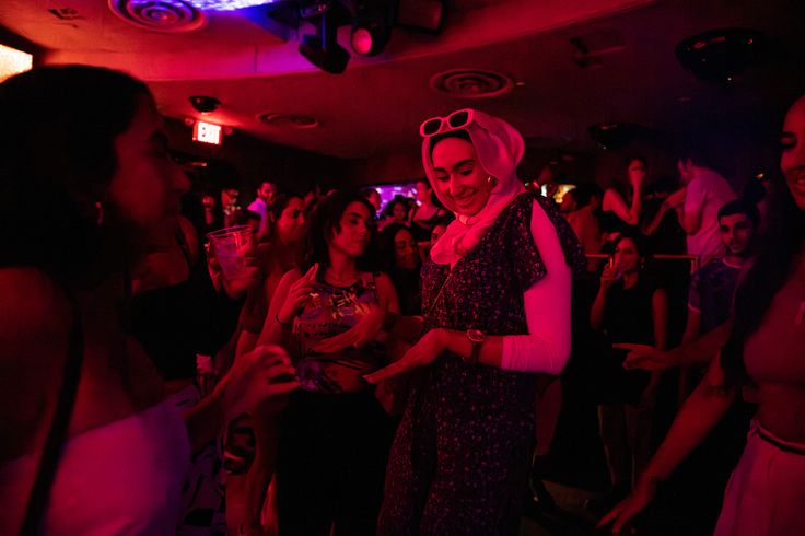 People dance as Hasnain DJs at Sultan Room in New York.