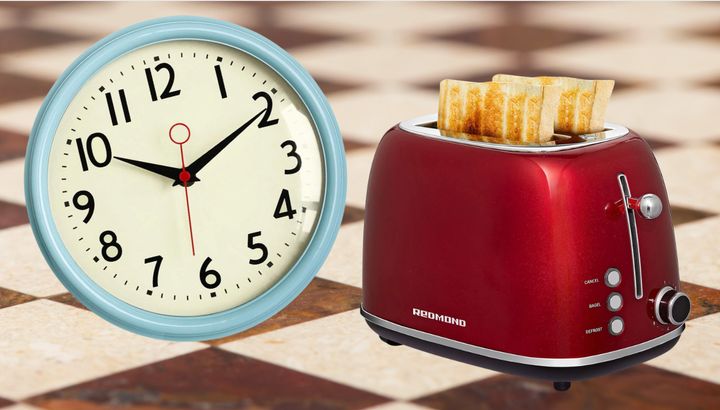 A wall clock and vintage-style toaster.