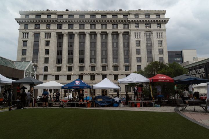 ATLANTA, GEORGIA - AUGUST 15: Members of the media remain set up in front of the Fulton County Courthouse on August 15, 2023 in Atlanta, Georgia. District Attorney Fani Willis presented evidence to a grand jury which has now indicted former President Donald Trump on alleged attempts to overturn the 2020 election results in the state. (Photo by Megan Varner/Getty Images)