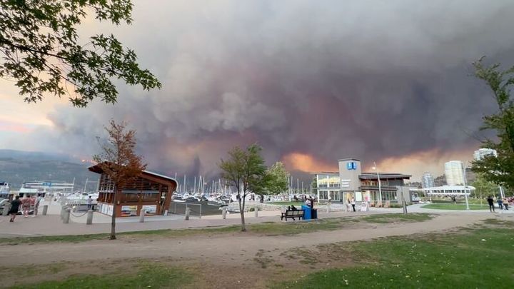 Smoke rises during the wildfire in Kelowna, British Columbia, Canada, on August 17, 2023, in this screen grab obtained from a social media video.