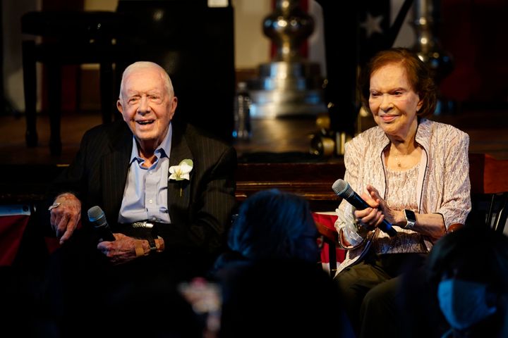 Former President Jimmy Carter and his wife, former First Lady Rosalynn Carter, sit together during a reception to celebrate their 75th anniversary in 2021. 
