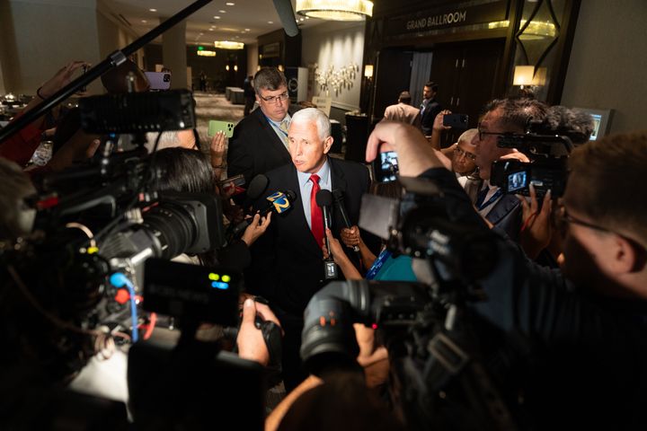 Former Vice President Mike Pence speaks to reporters at an event hosted by conservative radio host Erick Erickson on Friday, Aug. 18, in Atlanta, Georgia.