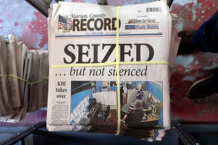 A stack of the latest weekly edition of the Marion County Record sits in the back of the newspaper's building, awaiting unbundling, sorting and distribution, Wednesday, Aug. 16, 2023, in Marion, Kan. The newspaper's front page was dedicated to two stories about a raid by local police on its offices and the publisher's home on Aug. 11, 2023. (AP Photo/John Hanna)