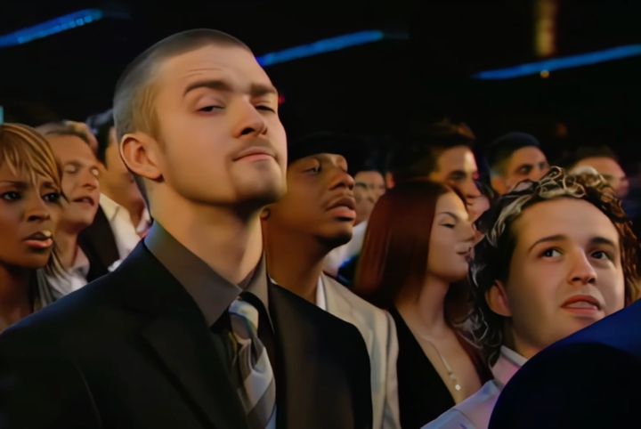 Justin Timberlake raises his eyebrow during his famous ex's VMAs performance