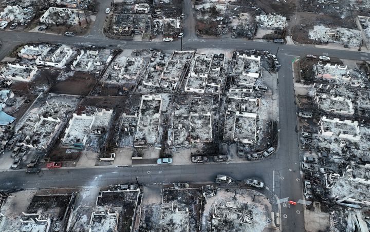 An aerial view of Lahaina taken on Friday shows burned cars and homes in a former neighborhood.