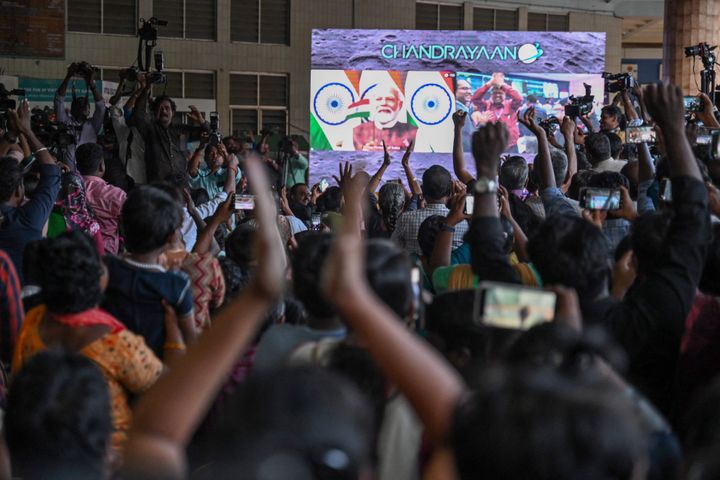 People celebrate the successful lunar landing of Chandrayaan-3 spacecraft on the south pole of the Moon, in Chennai on August 23, 2023. India became the first nation to successfully land a craft on the Moon's south pole on August 23, the latest milestone in a renewed push for lunar exploration that has drawn in both the world's top space powers and new players. (Photo by R. Satish BABU / AFP) (Photo by R. SATISH BABU/AFP via Getty Images)