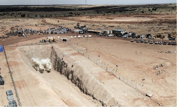 A photo dated Nov. 5, 2022, shows the "opening blast ceremony" commemorating the start of digging at the construction site for Toronto-based Global Atomic Corp.'s Dasa uranium mine in central Niger.