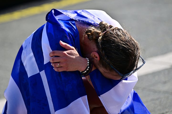 Athletics - World Athletics Championship - Women's 35 km Race Walk - Budapest, Hungary - August 24, 2023 Greece's Antigoni Ntrismpioti celebrates after winning the bronze medal in women's 35 km race walk REUTERS/Marton Monus