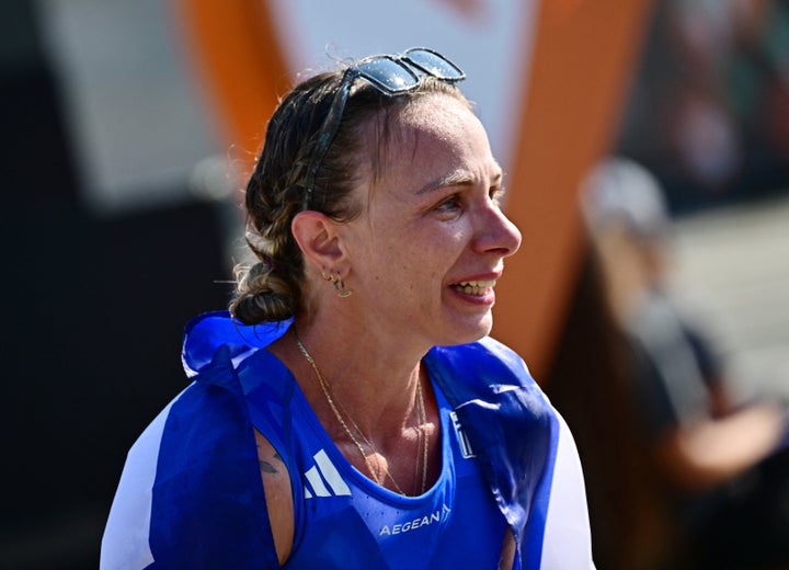 Athletics - World Athletics Championship - Women's 35 km Race Walk - Budapest, Hungary - August 24, 2023 Greece's Antigoni Ntrismpioti celebrates after winning the bronze medal in women's 35 km race walk REUTERS/Marton Monus