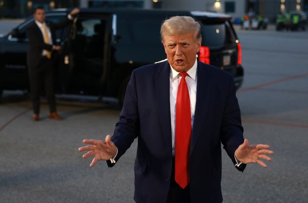 Former US President Donald Trump speaks to the media after being booked at the Fulton County jail on August 24, 2023 in Atlanta, Georgia.