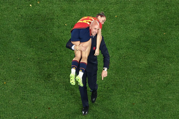 Luis Rubiales carries Spain's Athenea del Castillo Beivide on his shoulder following the team's Women's World Cup victory.