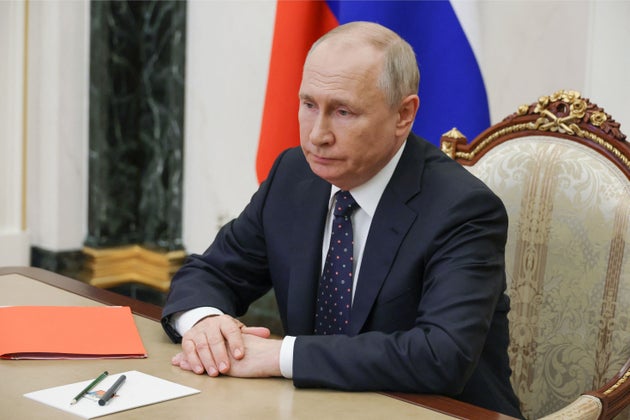 In this pool photograph distributed by Russian state owned agency President Vladimir Putin chairs a meeting with Security Council permanent members via video link in Moscow, on August 25, 2023.