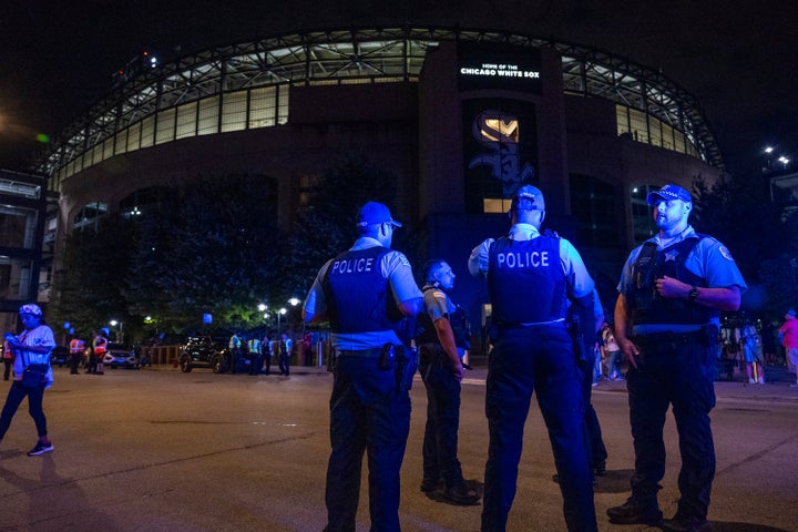 Chicago police officers stand outside Guaranteed Rate Field on Friday. Police are investigating a shooting during the Chicago White Sox game on Friday night.