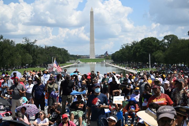 People participate in the 60th anniversary of the civil rights March on Washington at the Lincoln Memorial in Washington, DC, on August 26, 2023. (Photo by SAUL LOEB / AFP)