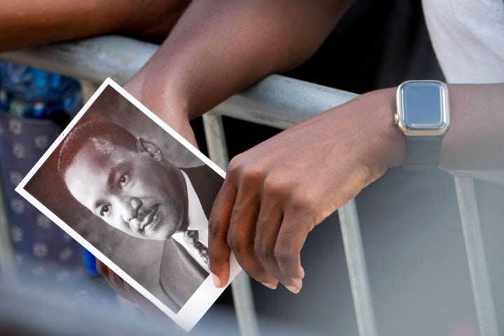 A person holds an image of the Rev. Martin Luther King Jr. as they listen to speakers during the 60th Anniversary of the March on Washington at the Lincoln Memorial in Washington, Saturday, Aug. 26, 2023. (AP Photo/Andrew Harnik)