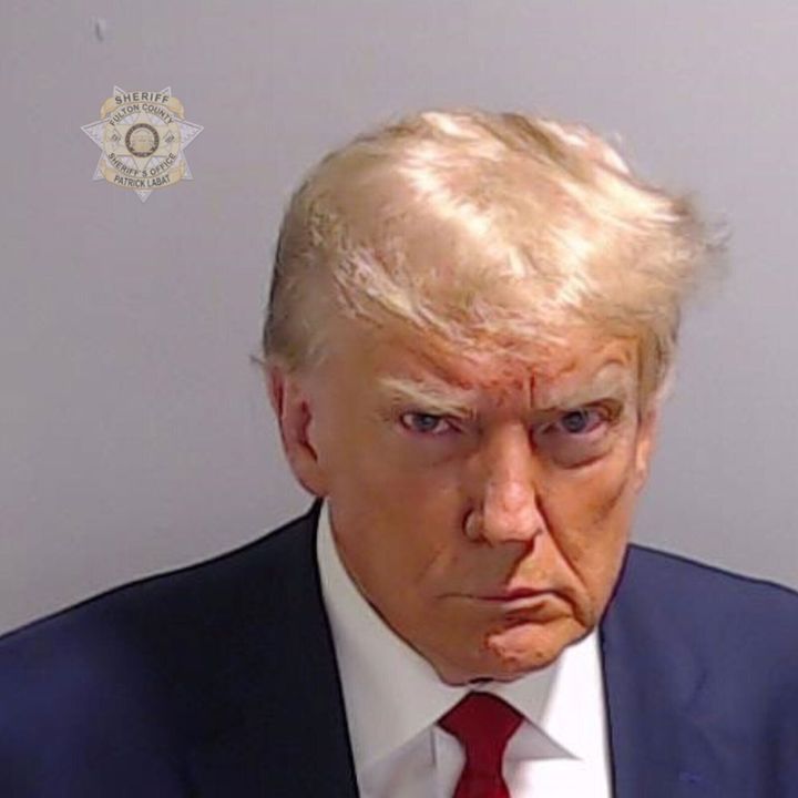 Former President Donald Trump poses for his booking photo at the Fulton County Jail on Thursday. Trump was booked on 13 charges related to an alleged plan to overturn the results of the 2020 presidential election in Georgia.