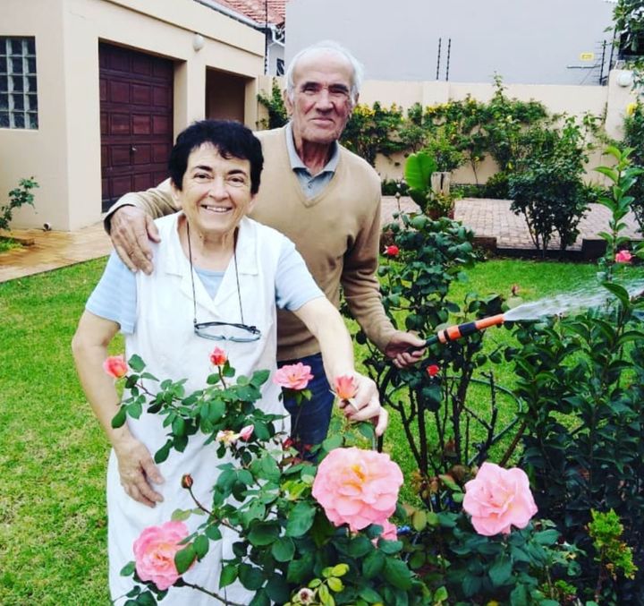 The author's mom and dad in the garden at their home in Johannesburg during the COVID pandemic in 2020. "My dad loved gardening and growing roses," she writes. "This is the last photo I have of him when he was still mobile."