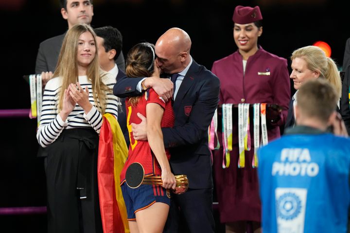 Luis Rubiales, right, hugs Spain's Aitana Bonmati on the podium following Spain's win in the final of Women's World Cup soccer against England.