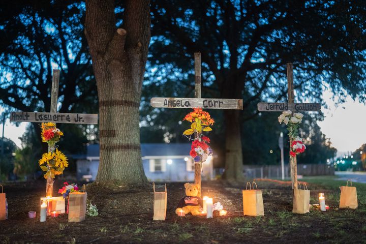 Candles burn at memorials for Angela Carr, Anolt Joseph Laguerre Jr. and Jerrald Gallion near a Dollar General store where they were shot and killed the day before on August 27, 2023 in Jacksonville, Florida. Police say that the attack by a gunman on Black customers at the store is being investigated as a hate crime.