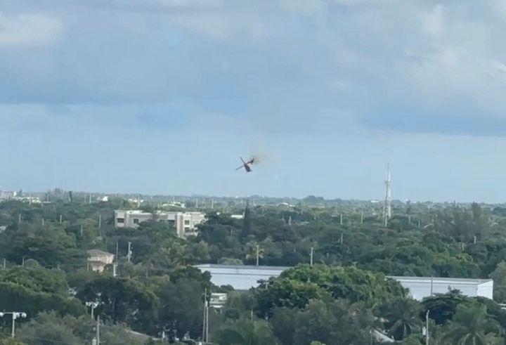 The helicopter was seen on fire shortly before spirling to the ground in Pompano Beach, Florida, on Monday.