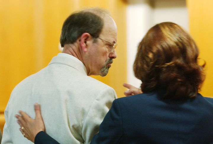 Dennis Rader consults with his lawyer, Sarah McKinnon, while entering his guilty pleas before Judge Gregory on June 27, 2005, admitting his guilt in 10 murders in the Wichita area.