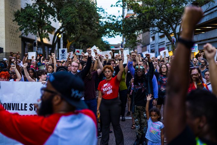 People march to honor the victims of a deadly shooting in Jacksonville, Florida on August 28, 2023. 