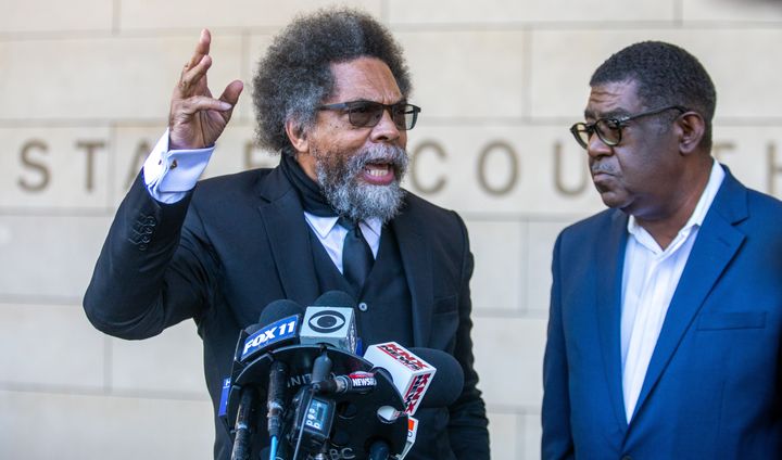 Cornel West (left) and Pastor Norman S. Johnson speak outside of a Los Angeles courthouse on Monday.
