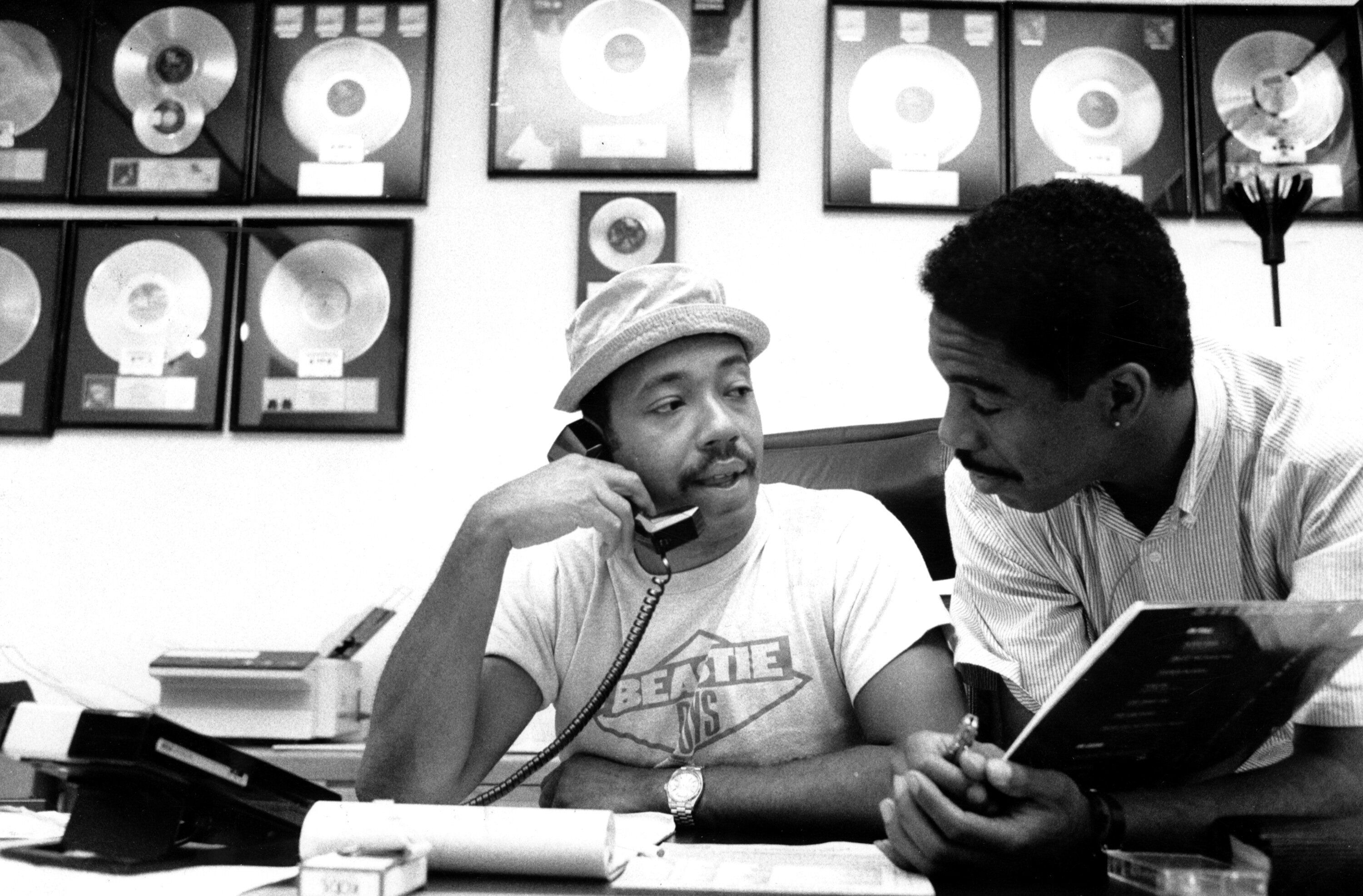Record producer Russell Simmons with an associate at 111 Barrow St. "Simmons is rarely without hat or phone."