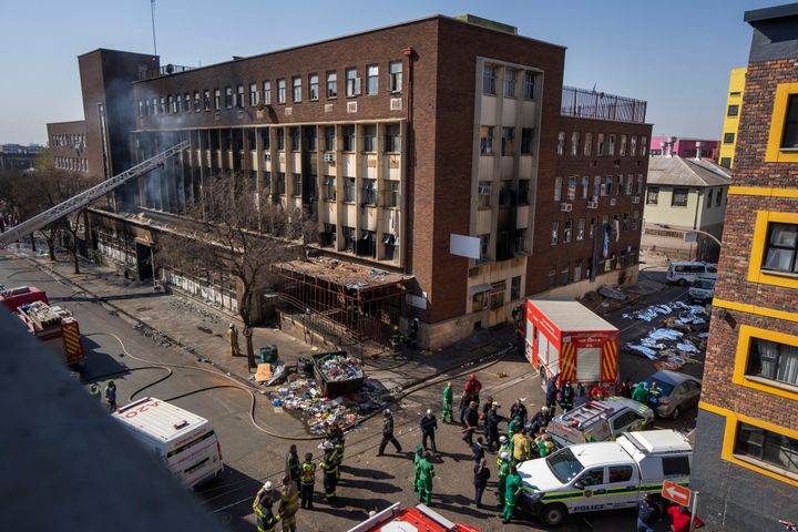 Medics and emergency works at the scene of a deadly blaze in downtown Johannesburg, on Aug. 31, 2023.