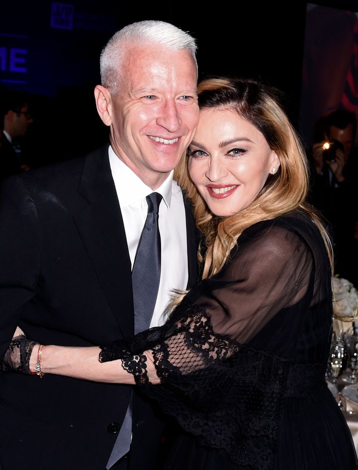 From left: anderson cooper and madonna at a 2016 charity gala.