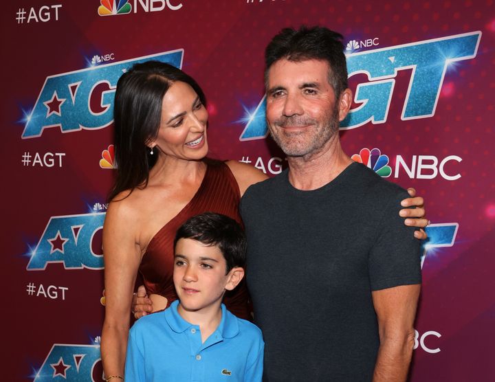 Lauren Silverman, Eric Cowell and Simon Cowell attend the red carpet for the "America's Got Talent" Season 17 live show in Pasadena, California, in 2022.
