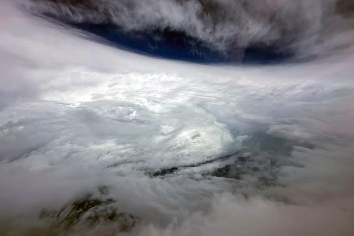 In this photo released by Hong Kong's Information Services Department, super typhoon Saola is seen from a Challenger 605 fixed-wing aircraft dispatched by the Government Flying Service near Hong Kong on Friday, Sept. 1, 2023. Hundreds of flights were cancelled as most of Hong Kong and other parts of southern China ground to a near standstill as Super Typhoon Saola edged closer Friday. (Information Services Department via AP)