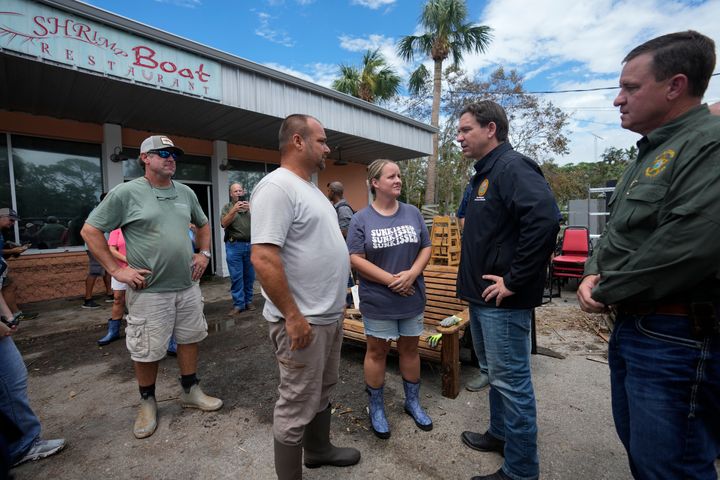 Florida Gov. Ron DeSantis speaks with the owners of Shrimp Boat, Horseshoe Beach's only restaurant, which was damaged by storm surge during the passage of Hurricane Idalia one day earlier, in Horseshoe Beach, Florida on Thursday.