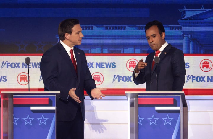 Florida Gov. Ron DeSantis and Vivek Ramaswamy talk during a break at the first GOP presidential debate in Milwaukee, Wisconsin last month. Eight presidential hopefuls squared off as former U.S. President Donald Trump, currently facing indictments in four locations, declined to participate in the event.