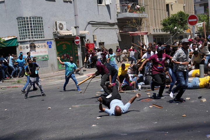 Anti-Eritrean government activists, left, clash with supporters of the Eritrean government, in Tel Aviv, Israel, on Sept. 2, 2023.