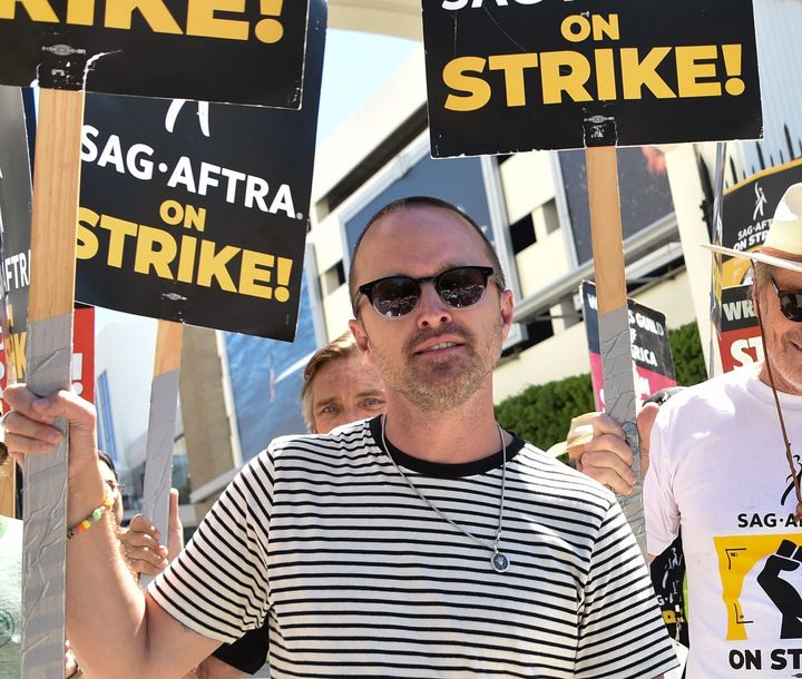 Aaron Paul joins the Screen Actors Guild (SAG-AFTRA) picket line Aug. 29 in front of Sony Pictures Entertainment Studios in Culver City, California.