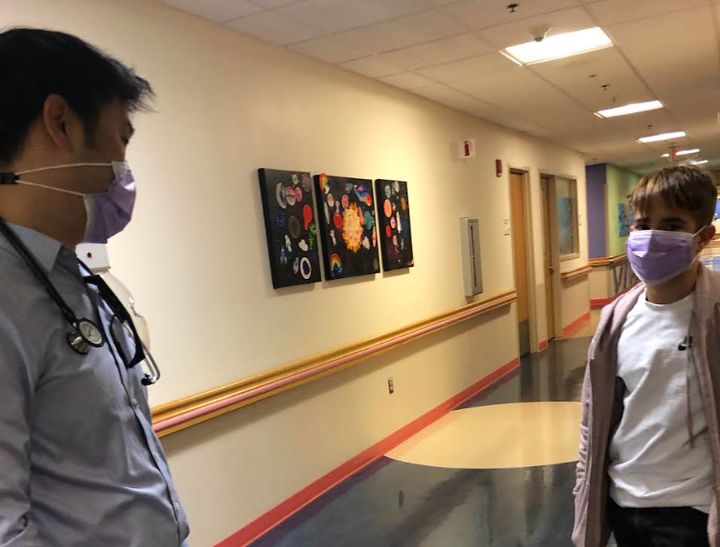 The author's son consulting with his doctor, Eugene Hwang, associate chief of oncology at Children's National Hospital in Washington, during treatment in 2020.