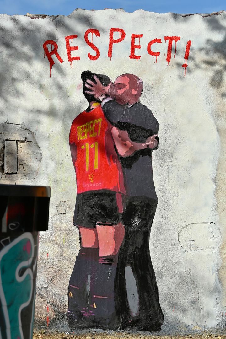 A mural in Barcelona, Spain, by Italian street artist TVBoy depicting Spanish Football Federation President Luis Rubiales kissing Spain midfielder Jenni Hermoso at the Women's World Cup.