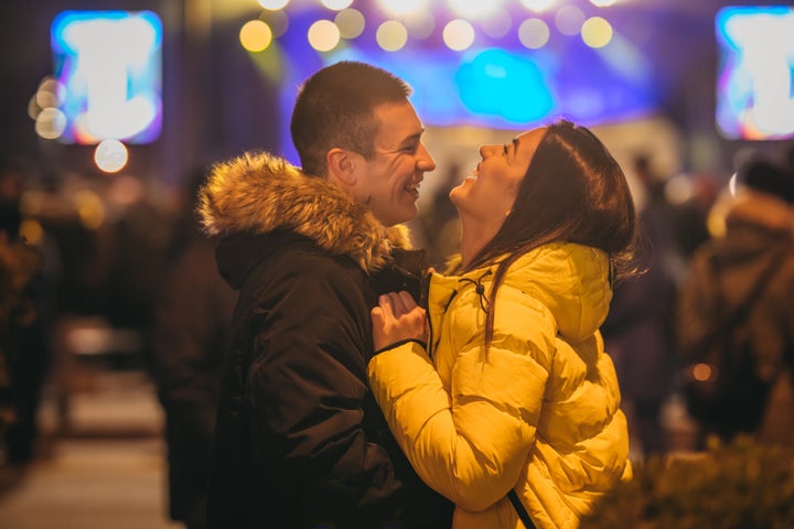 A young loving couple at a concert