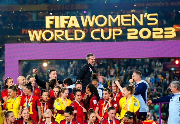 Spain manager Jorge Vilda (top) celebrates with his players after winning the FIFA Women's World Cup final match at Stadium Australia, Sydney. Picture date: Sunday August 20, 2023. (Photo by Zac Goodwin/PA Images via Getty Images)