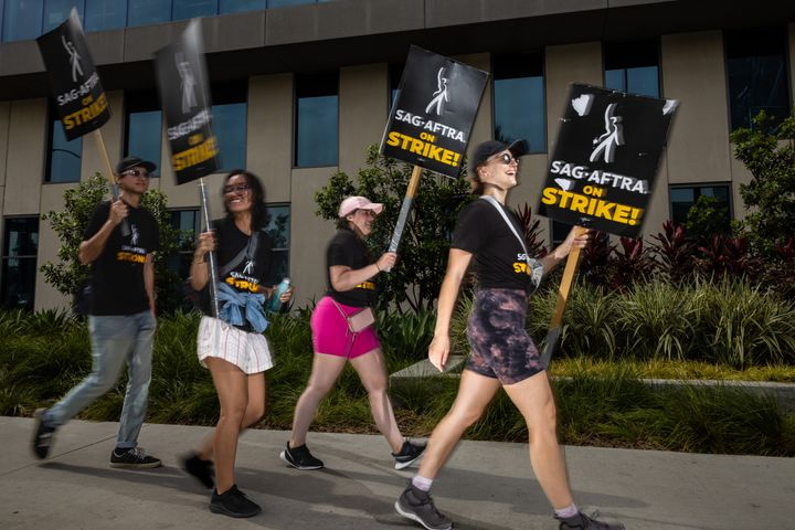 Members of WGA and members of SAG-AFTRA picket in front of Netflix headquarters in Hollywood on July 31.