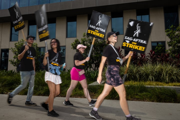 Members of WGA and members of SAG-AFTRA picket in front of Netflix headquarters in Hollywood on July 31.