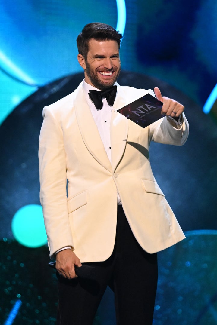 Joel Dommett on stage at the NTAs