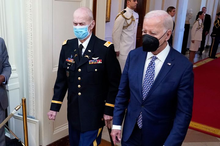 Army Capt. Larry Taylor and President Joe Biden masked up on their way to a Sept. 5 ceremony to honor Taylor.