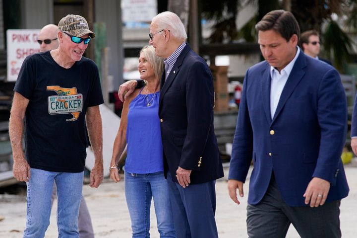 President Joe Biden tours an area impacted by Hurricane Ian on Oct. 5, 2022, in Fort Myers Beach, Florida. Gov. Ron DeSantis, visible on the right, accompanied the president at that time. 